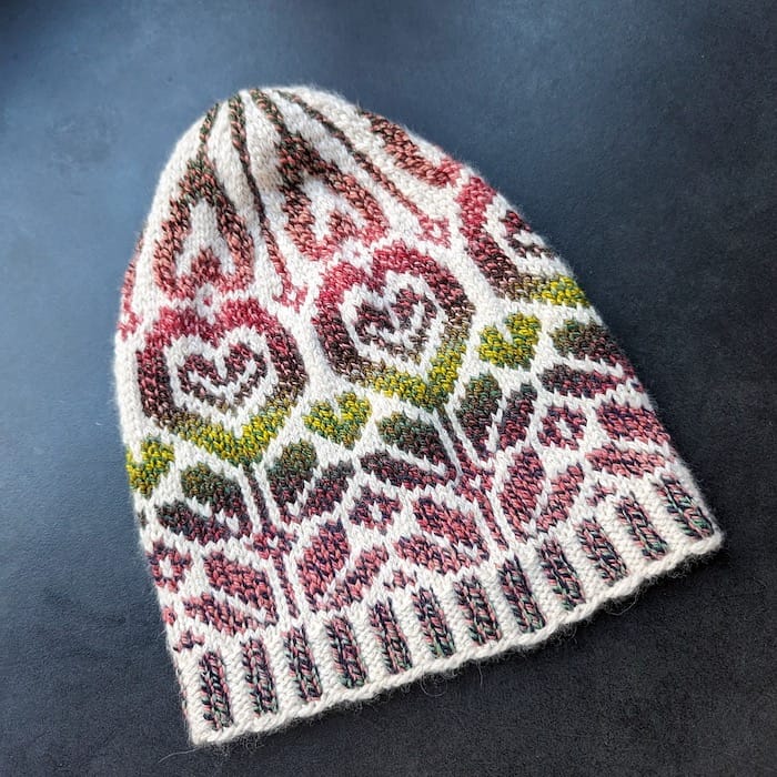 stranded colorwork hat with gradient heart-flower design